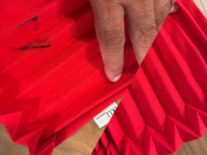 Before and after cleaning, an Issey Miyake purse