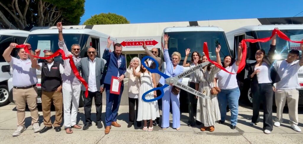A Crowd Gathers at the Santa Monica location to celebrate Door to Door's Electric Van Ribbon Cutting